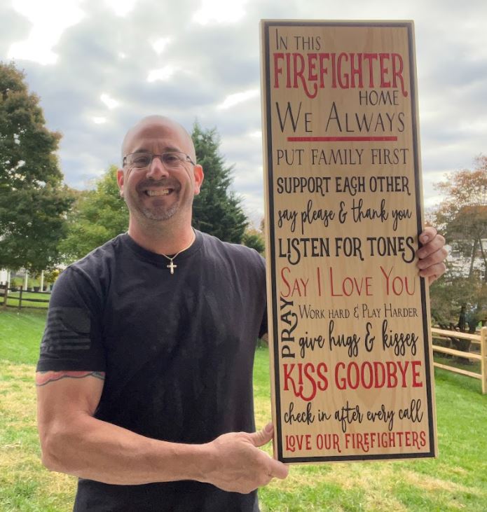 In this Firefighter Home Engraved 31" x 11" Sign